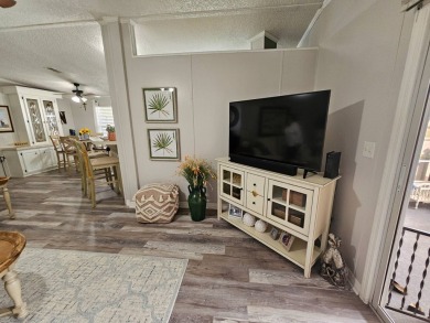 This immaculate 2-bedroom, 2-bath home has vinyl plank flooring on Big Cypress Golf and Country Club in Florida - for sale on GolfHomes.com, golf home, golf lot