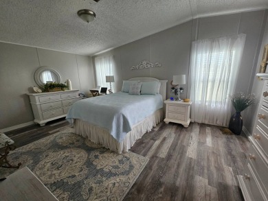 This immaculate 2-bedroom, 2-bath home has vinyl plank flooring on Big Cypress Golf and Country Club in Florida - for sale on GolfHomes.com, golf home, golf lot