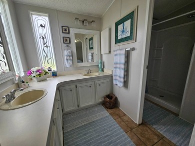 This immaculate 2-bedroom, 2-bath home has vinyl plank flooring on Big Cypress Golf and Country Club in Florida - for sale on GolfHomes.com, golf home, golf lot