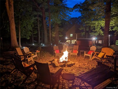 Nestled on nearly two acres of lush, tree-lined property, this on Hudson National Golf Club in New York - for sale on GolfHomes.com, golf home, golf lot