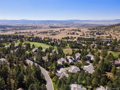 Discover luxury, convenience, and serenity in this stunning home on Country Club at Castle Pines in Colorado - for sale on GolfHomes.com, golf home, golf lot