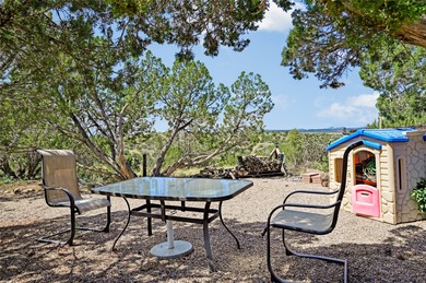 Single level home with views of the Sandias and surrounding on Pueblo de Cochiti Golf Course in New Mexico - for sale on GolfHomes.com, golf home, golf lot