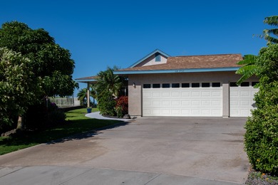 With sweeping 180-degree ocean views and a backdrop of 5 on Waikoloa Village Golf Club in Hawaii - for sale on GolfHomes.com, golf home, golf lot