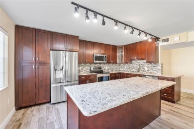 Beautifully renovated 3-bedroom, 2-bathroom corner unit in Holly on Woodmont Country Club in Florida - for sale on GolfHomes.com, golf home, golf lot