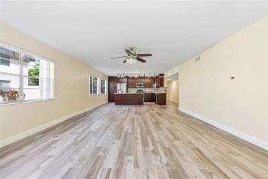 Beautifully renovated 3-bedroom, 2-bathroom corner unit in Holly on Woodmont Country Club in Florida - for sale on GolfHomes.com, golf home, golf lot
