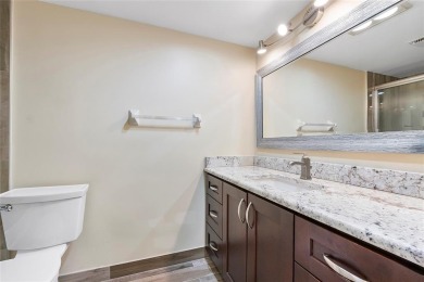 Beautifully renovated 3-bedroom, 2-bathroom corner unit in Holly on Woodmont Country Club in Florida - for sale on GolfHomes.com, golf home, golf lot