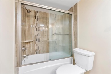Beautifully renovated 3-bedroom, 2-bathroom corner unit in Holly on Woodmont Country Club in Florida - for sale on GolfHomes.com, golf home, golf lot