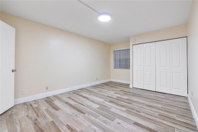 Beautifully renovated 3-bedroom, 2-bathroom corner unit in Holly on Woodmont Country Club in Florida - for sale on GolfHomes.com, golf home, golf lot
