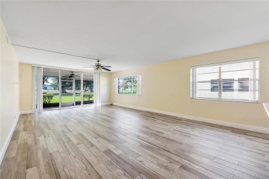Beautifully renovated 3-bedroom, 2-bathroom corner unit in Holly on Woodmont Country Club in Florida - for sale on GolfHomes.com, golf home, golf lot