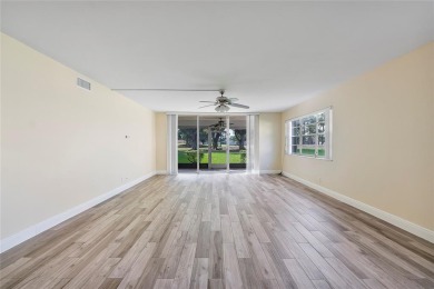 Beautifully renovated 3-bedroom, 2-bathroom corner unit in Holly on Woodmont Country Club in Florida - for sale on GolfHomes.com, golf home, golf lot