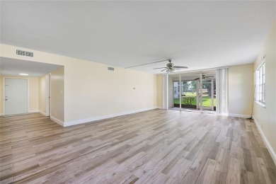 Beautifully renovated 3-bedroom, 2-bathroom corner unit in Holly on Woodmont Country Club in Florida - for sale on GolfHomes.com, golf home, golf lot