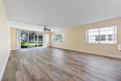 Beautifully renovated 3-bedroom, 2-bathroom corner unit in Holly on Woodmont Country Club in Florida - for sale on GolfHomes.com, golf home, golf lot
