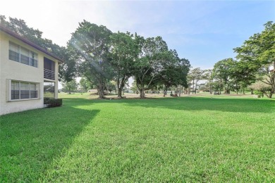 Beautifully renovated 3-bedroom, 2-bathroom corner unit in Holly on Woodmont Country Club in Florida - for sale on GolfHomes.com, golf home, golf lot