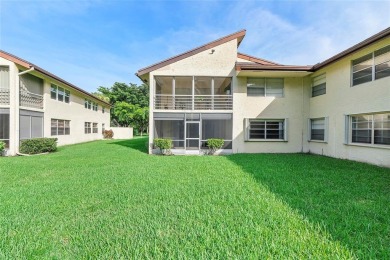 Beautifully renovated 3-bedroom, 2-bathroom corner unit in Holly on Woodmont Country Club in Florida - for sale on GolfHomes.com, golf home, golf lot