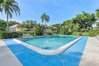 Beautifully renovated 3-bedroom, 2-bathroom corner unit in Holly on Woodmont Country Club in Florida - for sale on GolfHomes.com, golf home, golf lot