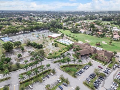 Beautifully renovated 3-bedroom, 2-bathroom corner unit in Holly on Woodmont Country Club in Florida - for sale on GolfHomes.com, golf home, golf lot