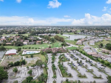 Beautifully renovated 3-bedroom, 2-bathroom corner unit in Holly on Woodmont Country Club in Florida - for sale on GolfHomes.com, golf home, golf lot