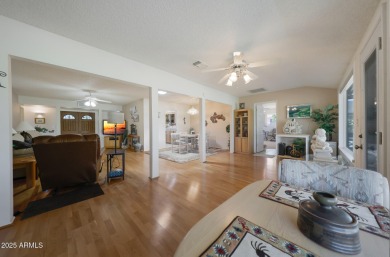Stop By And View This Expanded Coconino Model Home On Hole on Sun City Lakes West and East in Arizona - for sale on GolfHomes.com, golf home, golf lot