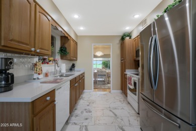 Stop By And View This Expanded Coconino Model Home On Hole on Sun City Lakes West and East in Arizona - for sale on GolfHomes.com, golf home, golf lot