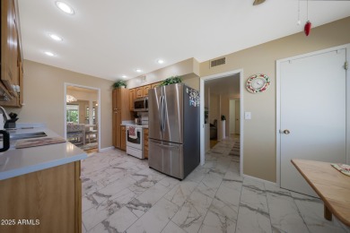 Stop By And View This Expanded Coconino Model Home On Hole on Sun City Lakes West and East in Arizona - for sale on GolfHomes.com, golf home, golf lot