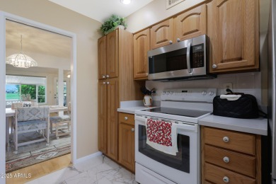 Stop By And View This Expanded Coconino Model Home On Hole on Sun City Lakes West and East in Arizona - for sale on GolfHomes.com, golf home, golf lot