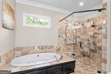 Welcome to luxury living on the largest lot in Riverwood on Champions Retreat Golf Club in Georgia - for sale on GolfHomes.com, golf home, golf lot