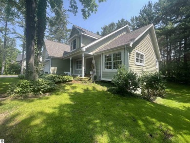 Discover unparalleled executive living perfectly situated on the on Traverse City Golf and Country Club in Michigan - for sale on GolfHomes.com, golf home, golf lot
