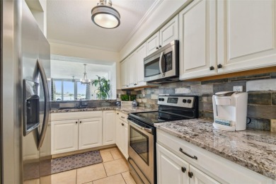 Your tropical waterfront living on Boca Ciega Bay awaits! Escape on Isla Del Sol Yacht and Country Club in Florida - for sale on GolfHomes.com, golf home, golf lot