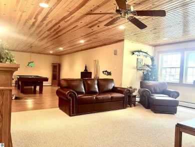 Discover unparalleled executive living perfectly situated on the on Traverse City Golf and Country Club in Michigan - for sale on GolfHomes.com, golf home, golf lot