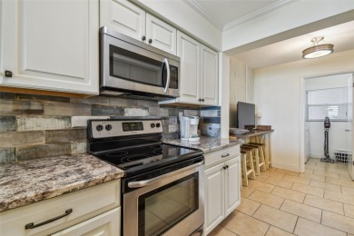 Your tropical waterfront living on Boca Ciega Bay awaits! Escape on Isla Del Sol Yacht and Country Club in Florida - for sale on GolfHomes.com, golf home, golf lot