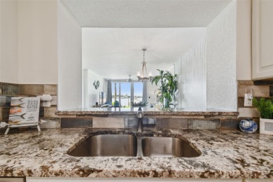 Your tropical waterfront living on Boca Ciega Bay awaits! Escape on Isla Del Sol Yacht and Country Club in Florida - for sale on GolfHomes.com, golf home, golf lot