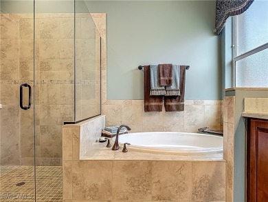 This home has a brand-New Roof! Stunning Panoramic Lake & Golf on Pelican Preserve Golf Club in Florida - for sale on GolfHomes.com, golf home, golf lot