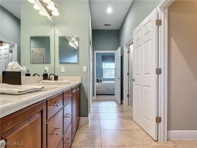 This home has a brand-New Roof! Stunning Panoramic Lake & Golf on Pelican Preserve Golf Club in Florida - for sale on GolfHomes.com, golf home, golf lot