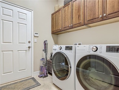 This home has a brand-New Roof! Stunning Panoramic Lake & Golf on Pelican Preserve Golf Club in Florida - for sale on GolfHomes.com, golf home, golf lot