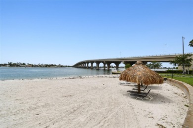 Your tropical waterfront living on Boca Ciega Bay awaits! Escape on Isla Del Sol Yacht and Country Club in Florida - for sale on GolfHomes.com, golf home, golf lot