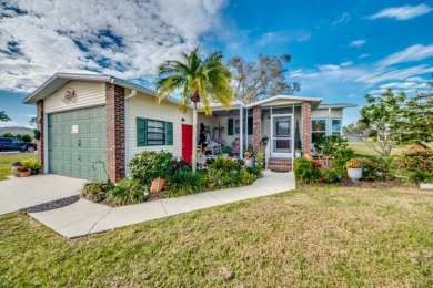 This great two-bed, two-bath home is located on the course at on Pine Lakes Country Club in Florida - for sale on GolfHomes.com, golf home, golf lot