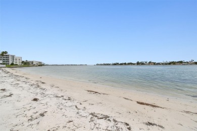 Your tropical waterfront living on Boca Ciega Bay awaits! Escape on Isla Del Sol Yacht and Country Club in Florida - for sale on GolfHomes.com, golf home, golf lot
