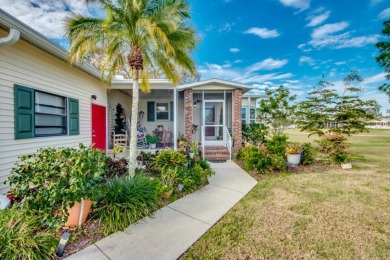 This great two-bed, two-bath home is located on the course at on Pine Lakes Country Club in Florida - for sale on GolfHomes.com, golf home, golf lot