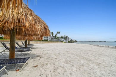 Your tropical waterfront living on Boca Ciega Bay awaits! Escape on Isla Del Sol Yacht and Country Club in Florida - for sale on GolfHomes.com, golf home, golf lot