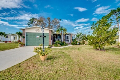 This great two-bed, two-bath home is located on the course at on Pine Lakes Country Club in Florida - for sale on GolfHomes.com, golf home, golf lot
