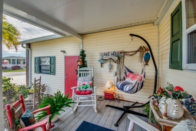 This great two-bed, two-bath home is located on the course at on Pine Lakes Country Club in Florida - for sale on GolfHomes.com, golf home, golf lot
