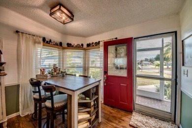 This great two-bed, two-bath home is located on the course at on Pine Lakes Country Club in Florida - for sale on GolfHomes.com, golf home, golf lot
