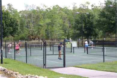 This home has a brand-New Roof! Stunning Panoramic Lake & Golf on Pelican Preserve Golf Club in Florida - for sale on GolfHomes.com, golf home, golf lot