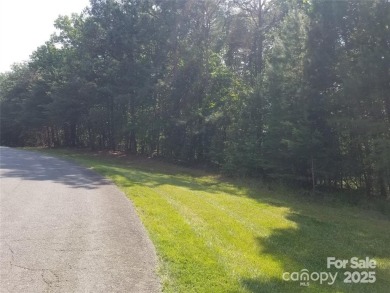 This Badin Lake waterfront lot is located in the prestigious on Old North State Club at Uwharrie Point Golf community in North Carolina - for sale on GolfHomes.com, golf home, golf lot