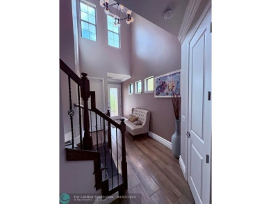 Check out this lovely, five-bedroom, three-bathroom home. This on Woodmont Country Club in Florida - for sale on GolfHomes.com, golf home, golf lot