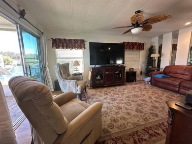 Beautifully Renovated 2-Bedroom, 2-Bath Home with Stunning Lake on Vista Plantation Golf Club in Florida - for sale on GolfHomes.com, golf home, golf lot