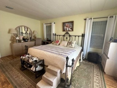 Beautifully Renovated 2-Bedroom, 2-Bath Home with Stunning Lake on Vista Plantation Golf Club in Florida - for sale on GolfHomes.com, golf home, golf lot