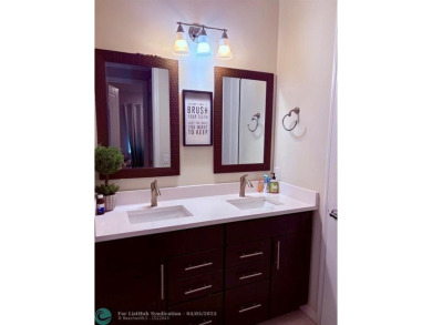 Check out this lovely, five-bedroom, three-bathroom home. This on Woodmont Country Club in Florida - for sale on GolfHomes.com, golf home, golf lot