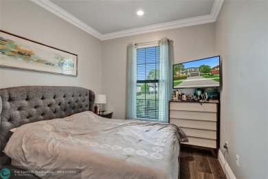 Check out this lovely, five-bedroom, three-bathroom home. This on Woodmont Country Club in Florida - for sale on GolfHomes.com, golf home, golf lot