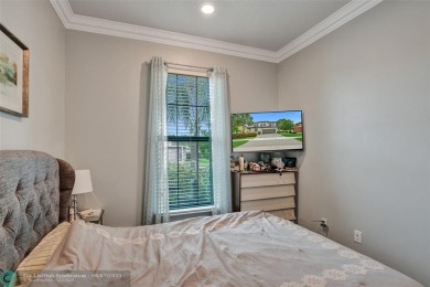 Check out this lovely, five-bedroom, three-bathroom home. This on Woodmont Country Club in Florida - for sale on GolfHomes.com, golf home, golf lot